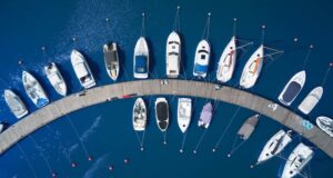 Banner showing a fleet of boats and yachts on the water.