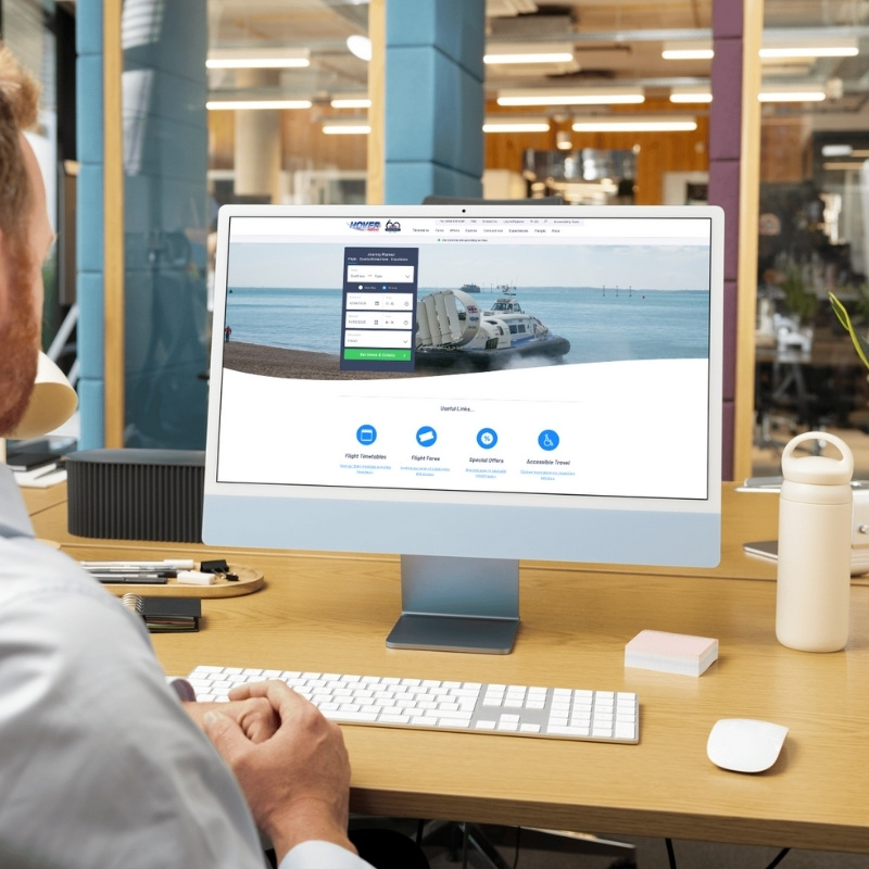 Computer screen mockup presenting the Hovertravel website layout.