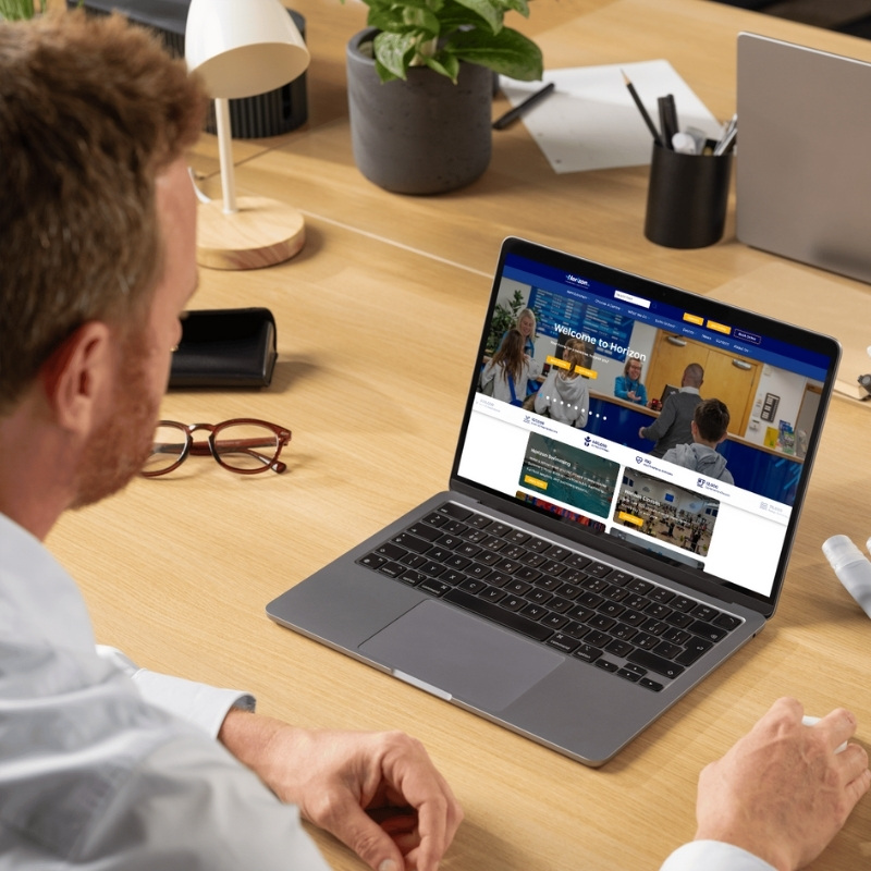 Laptop mockup showcasing the Horizon Leisure website homepage.