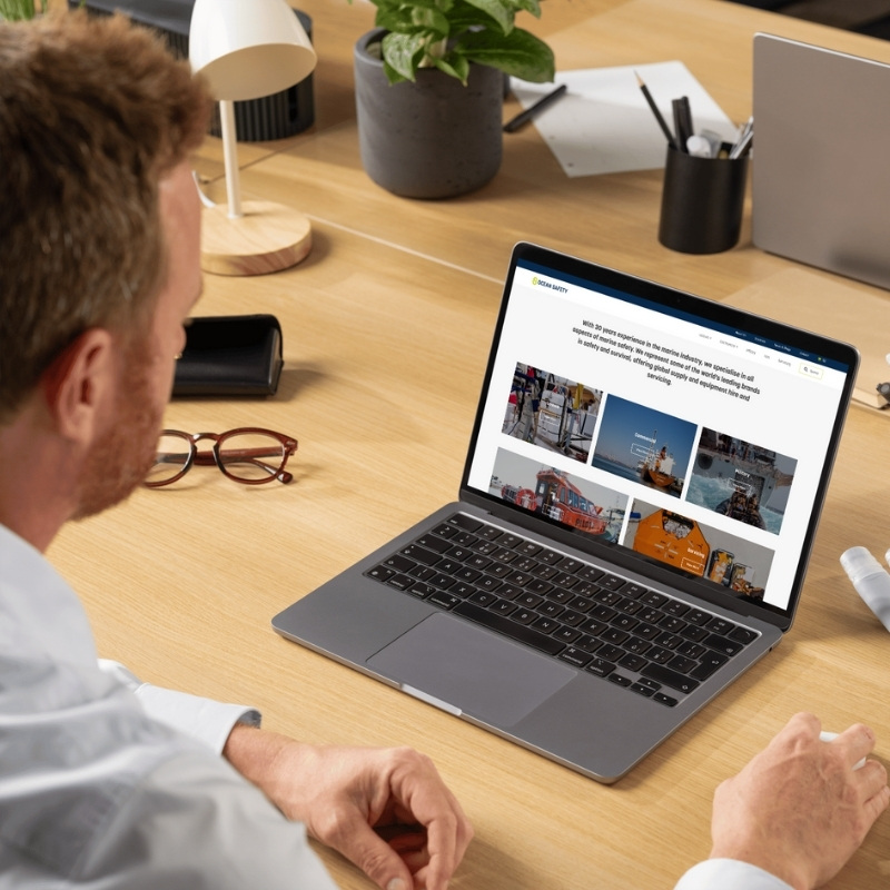 Laptop mockup presenting the Ocean Safety website homepage.