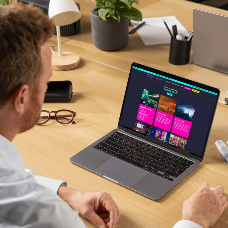 Laptop mockup showcasing the Radar Festival website homepage.