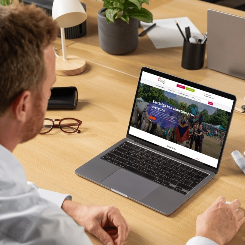 Laptop mockup showcasing the Visit Eastleigh website homepage.