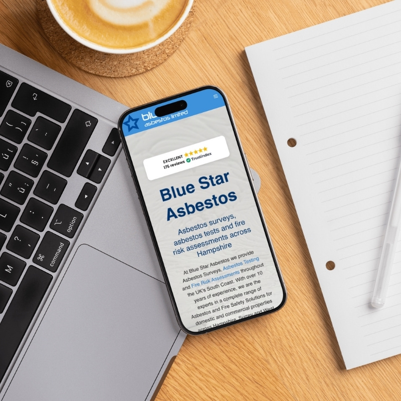 Smartphone screen mockup showing the Blue Star Asbestos website design.