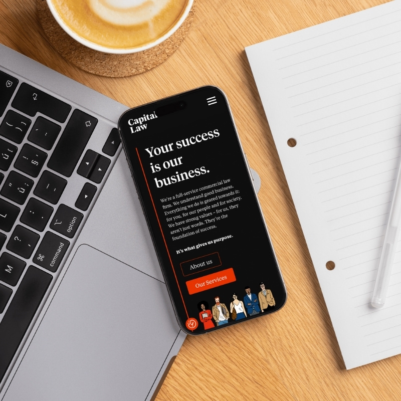 Smartphone screen mockup showing the Capital Law website design.