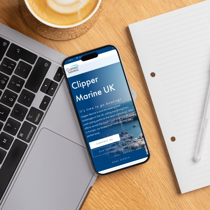 Smartphone screen mockup showing the Clipper Marine website design.