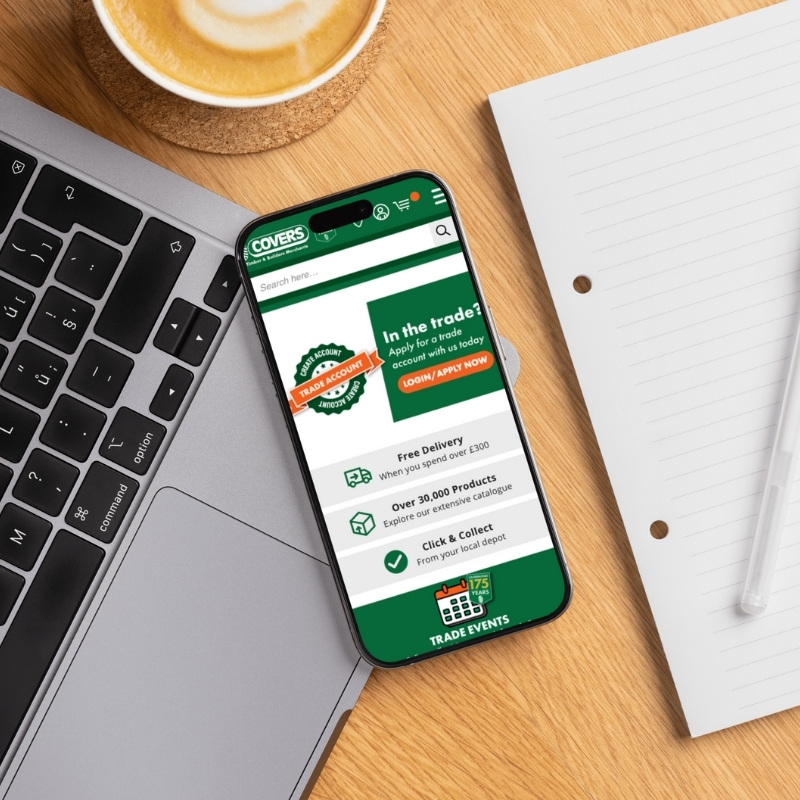 Smartphone screen mockup showing the Covers Timber & Builders Merchants website design.
