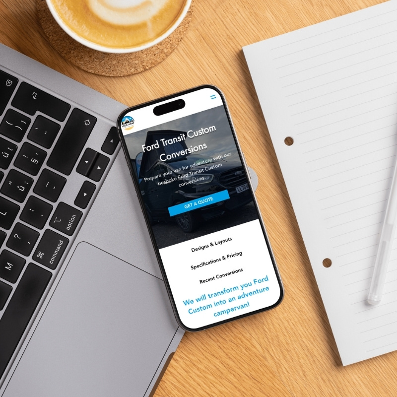 Smartphone screen mockup showing the Hideaway Campervans website design.