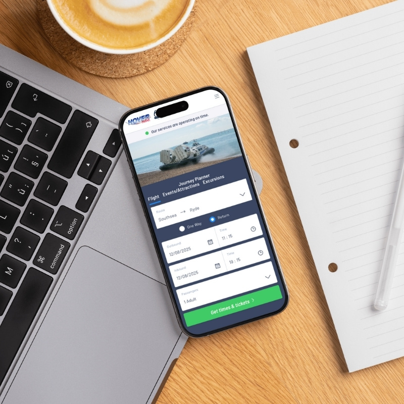 Smartphone screen mockup showing the Hovertravel website design.