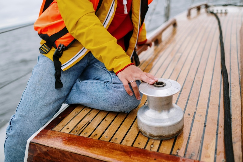 Hands assembling a life-saving marine safety device.