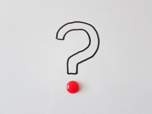Red question mark icon on a light grey background.